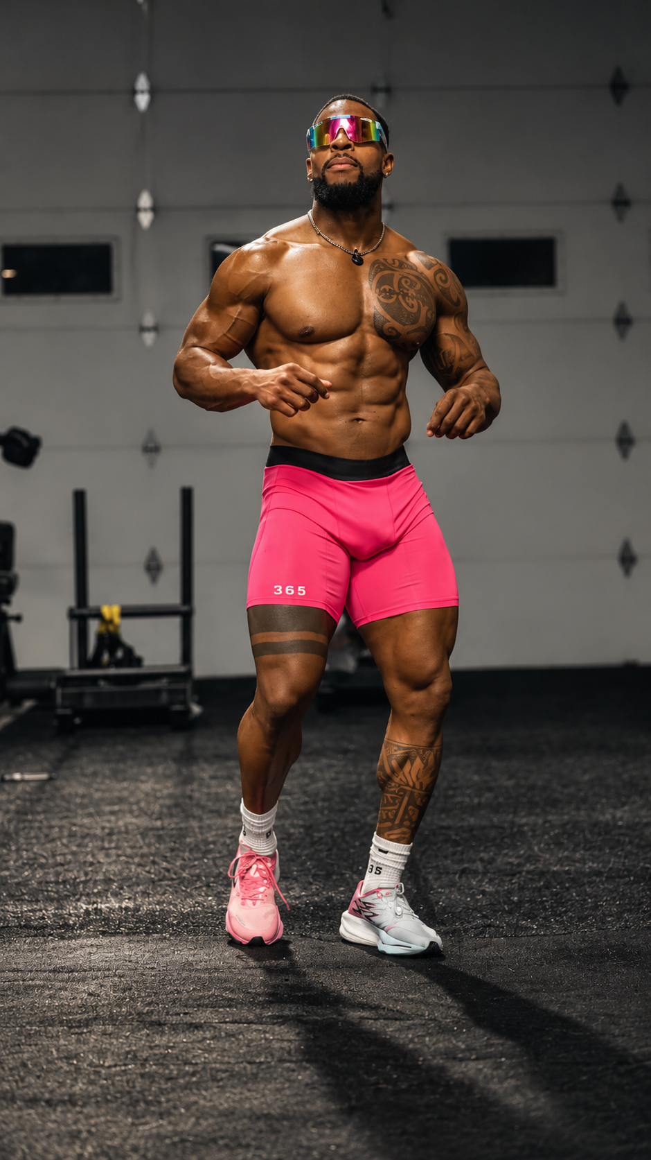 Athlete wearing pink 365 fitted shorts in the gym
